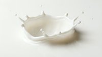 Milk or cream splash frozen in mid-air with dynamic droplets and splashes radiating outward, creating a crown-like formation on neutral background for beverage and dairy product advertising.