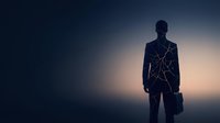 Silhouette of a man in business suit holding briefcase against glowing geometric network lines, representing digital transformation, innovation, and corporate connectivity for business concepts.