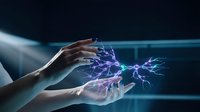 Human hands creating magical purple lightning energy between palms with electric sparks and glowing effects on dark futuristic background.