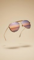 Stylish aviator sunglasses with gradient lenses floating on neutral beige background for fashion and eyewear advertising campaigns.