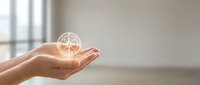 Hands cupping glowing globe with network connections symbolizing global communication, technology innovation and digital transformation in modern office.