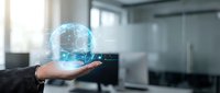 Businessman holding holographic globe with network connections in modern office environment showcasing global business technology and digital transformation.