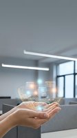 Hands holding holographic digital network with glowing nodes and circuit patterns in modern office environment for technology and innovation concepts.