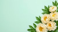Elegant cream peonies with lush green foliage arranged on soft mint background with copy space for wedding invitations and spring designs.