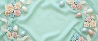 Elegant mint green silk fabric background with delicate roses, pearls and ribbons frame border for wedding invitations, greeting cards and feminine designs.