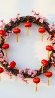 Festive wreath with red lanterns and pink cherry blossoms on white background for Chinese New Year celebration and spring festival decorations.