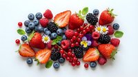 Fresh mixed berries collection with strawberries, blueberries, raspberries, blackberries and red currants on white background for healthy eating concepts.