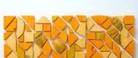 Abstract geometric mosaic with orange and yellow triangular tiles creating dynamic angular pattern for modern interior design and contemporary decor projects.