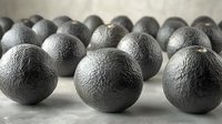 Fresh ripe oranges with textured peel arranged in rows on light surface, dramatic lighting creates depth and shadows in monochrome artistic composition.