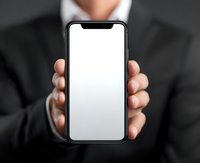 Businessman in formal suit holding modern smartphone with blank white screen, perfect for adding custom app or website mockup.