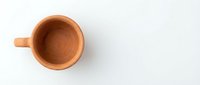 Empty wooden cup on white background, isolated tableware for beverage mockups and design projects.