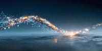 Magical glowing light trail with sparkling particles flowing over calm water surface against dark blue night sky background.