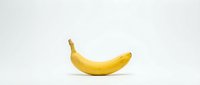 Single ripe yellow banana isolated on white background, ready for design use in food, nutrition, and healthy lifestyle projects.