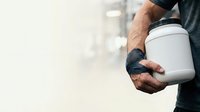 Male worker with dark skin tone holding white container with black lid, wearing dark work gloves and dark shirt. Suitable for industrial, construction, maintenance, and labor-related projects.