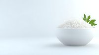 White steamed rice served in minimalist ceramic bowl with fresh parsley garnish on light background, food photography for restaurant menu and culinary projects.