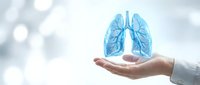 Healthcare professional holding glowing blue lungs hologram representing respiratory medicine and pulmonary health care concepts for medical presentations.