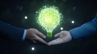 Glowing green light bulb with digital network effect floating between business people hands against dark background, representing innovation and collaboration.