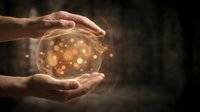 Hands holding glowing orb with golden light particles, symbolizing magic, energy, future vision, and spiritual power for mystical and inspirational concepts.