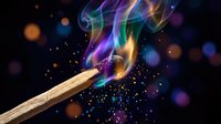 Wooden matchstick igniting with vibrant rainbow colored flames and magical sparks against dark background with bokeh lights for creative design projects.