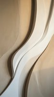 Abstract flowing curves in neutral beige and white tones creating organic architectural forms with soft shadows and smooth transitions for modern design.