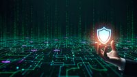 Cybersecurity shield protection concept with human hand touching glowing security icon over digital grid network background with data streams.