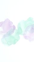 Soft watercolor abstract background with purple and green paint splashes on white canvas for creative design projects.