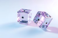 Transparent glass dice with iridescent reflections cast pink and blue hues on light background, creating magical casino gaming atmosphere.