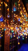 Glowing blue and golden light bulbs hanging from ceiling create magical atmosphere with bokeh effect. Perfect for festive holiday decorations and events.