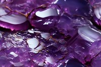 Macro view of amethyst crystal clusters showing deep purple hues, natural formations, and reflective surfaces in detailed close-up photography.