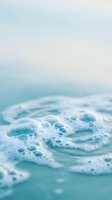 Close-up of ocean waves with white foam and bubbles rolling onto turquoise water, ideal for travel and nature backgrounds.