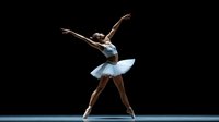 Graceful African American ballerina in white tutu performs elegant dance pose on dark stage with dramatic lighting, arms extended in classical ballet position.