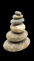 Stacked smooth stones in natural gray and beige tones, isolated on transparent background. Ready for wellness, spa, meditation, and zen design projects including t-shirts, stickers, and print-on-demand products.