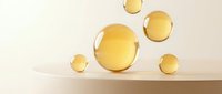Golden spheres of varying sizes arranged on a neutral surface, featuring glossy, reflective orbs in warm tones. Suitable for cosmetics, skincare, wellness, and luxury branding projects.