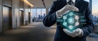 Businessman in formal suit holding digital holographic network interface with interconnected icons in modern office lobby with city skyline view.