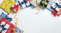 Colorful wrapped gift boxes with ribbons and bows arranged on white background, ideal for holiday, celebration, and festive design projects.