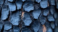 Dramatic close-up of charred wood texture showing deep cracks and layered burnt patterns in blue tones, revealing intricate natural patterns and textures from fire damage.