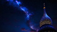 Illuminated dome against starry night sky with vibrant Milky Way galaxy stretching across deep blue space, architectural silhouette creates magical atmosphere.