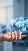 Woman's hand holding glowing cloud computing icons with gears and growth charts, symbolizing digital transformation and data technology.