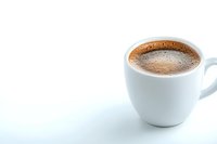 Fresh espresso in white ceramic cup against light background with copy space, minimalist composition showing rich crema and aromatic coffee surface.