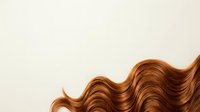 Shiny copper-toned wavy hair strands isolated on white background, suitable for hair care, beauty, and salon design projects.