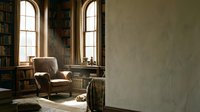 Cozy reading corner with vintage leather armchair near arched windows in classic library interior with wooden bookshelves and warm natural lighting.