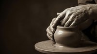 Artisan hands shaping clay on pottery wheel, traditional ceramic craftsmanship and handmade pottery creation process for art and craft education.