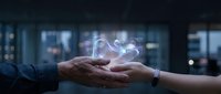Business partnership handshake with digital network connection hologram representing collaboration, teamwork and professional agreement in modern office.