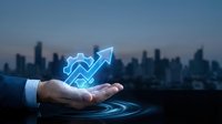 Business growth concept with glowing arrow chart above businessman hand against city skyline at dusk for financial success presentations.