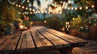 Rustic wooden table on cozy patio with string lights and plants creating warm evening ambiance for outdoor dining or entertaining.