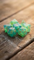 Green translucent polyhedral dice set with gold numbers on rustic wooden surface for tabletop gaming and role-playing adventures.