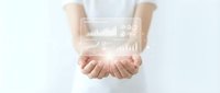 Business professional presenting holographic data analytics dashboard with charts and graphs floating above open palms on clean white background.