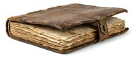 Antique leather-bound book with aged pages and worn brown cover, isolated on white background for design and publishing projects.