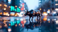 Bronze bull figurine reflecting on wet city street surface with blurred urban lights and bokeh creating dramatic nighttime atmosphere. Symbolic financial concept.