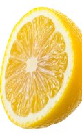 Fresh lemon slice with juicy pulp and segments isolated on white background for culinary designs and healthy food concepts.